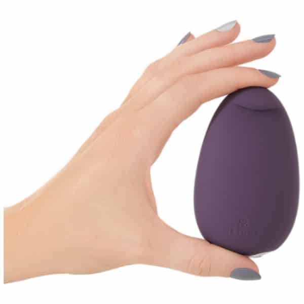 Purple MiMi Soft vibrator held in a hand