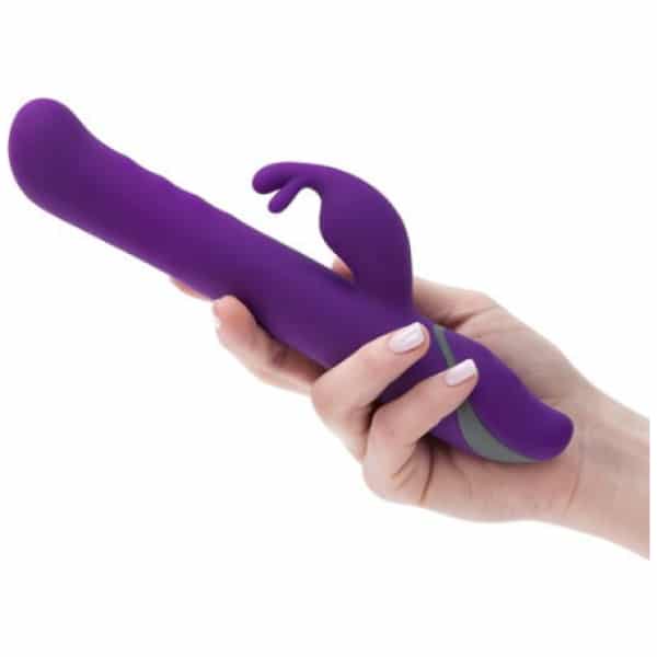 Dark purple Commotion Samba rabbit vibrator held in hand
